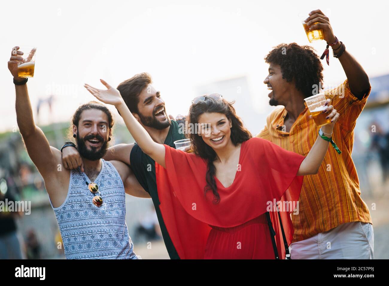 Group of happy friends people having fun together outdoors Stock Photo