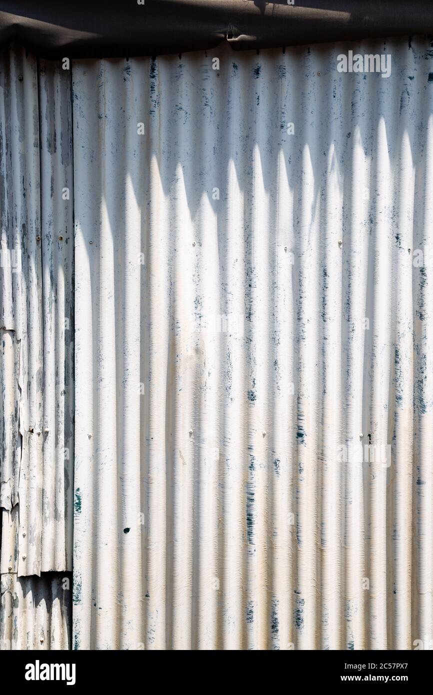 White painted wave metal sheet wall texture background Stock Photo