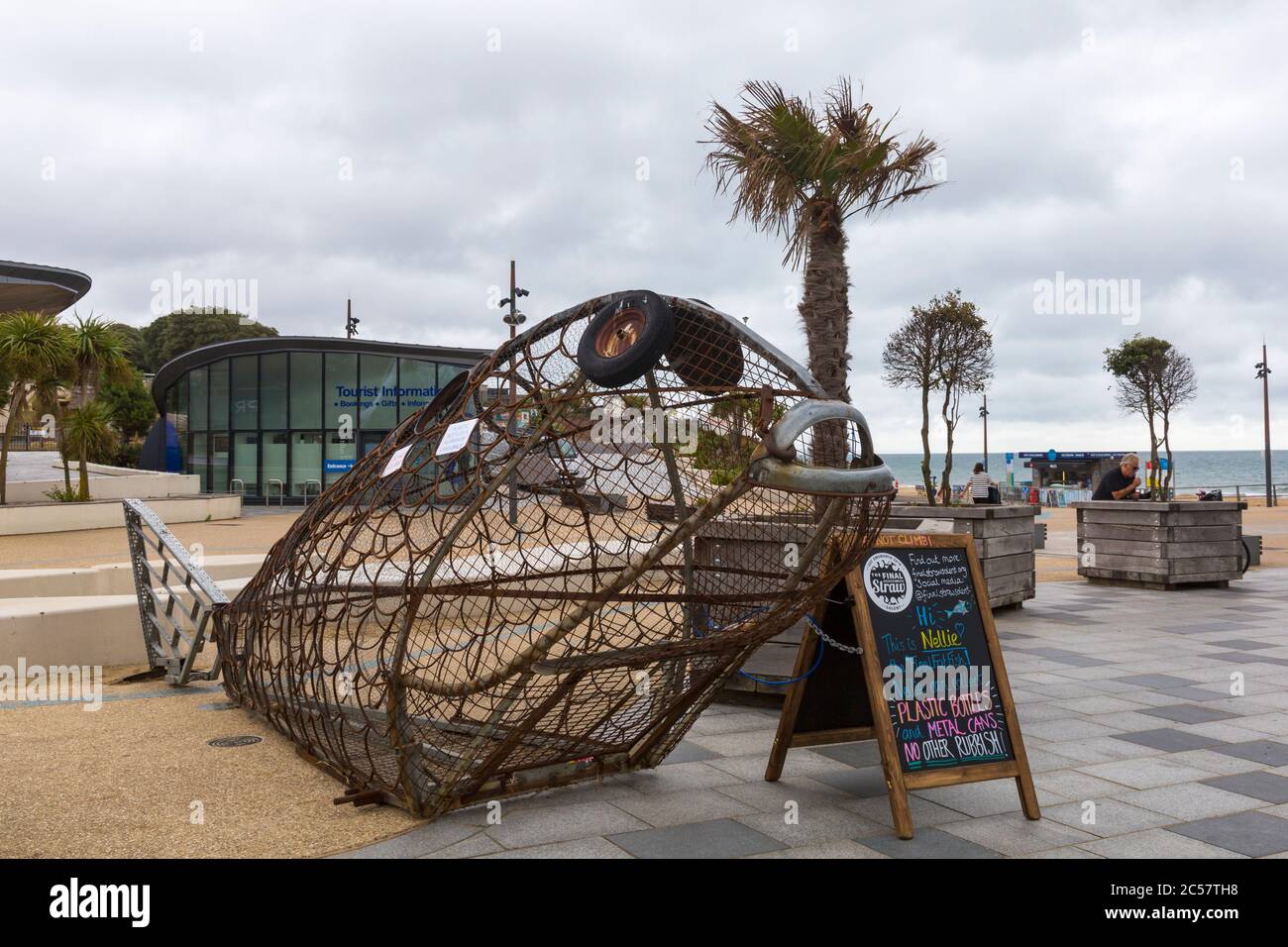 Bournemouth, Dorset UK. 1st July 2020. Nellie the fish, a giant metal fish sculpture arrives in Bournemouth to promote recycling and single use plastic. 2 metres high and made of reclaimed metal it encourages visitors to recycle and dispose of their plastic bottles and metal cans by feeding Nellie. Tons of rubbish, including plastic bottles and cans, were just left on Bournemouth beach last week and had to be picked up by council workers and volunteers. Credit: Carolyn Jenkins/Alamy Live News Stock Photo