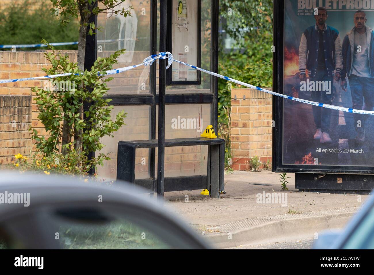 Essex, UK. 1st July 2020. Three men have been arrested on suspicion of attempted murder in South Ockendon after a man was attacked with a 'large knife' early this morning. Blood can be seen on a nearby bus stop and a silver/grey Vauxhall Astra has been removed from the scene by police. Ricci Fothergill/Alamy Live News Stock Photo