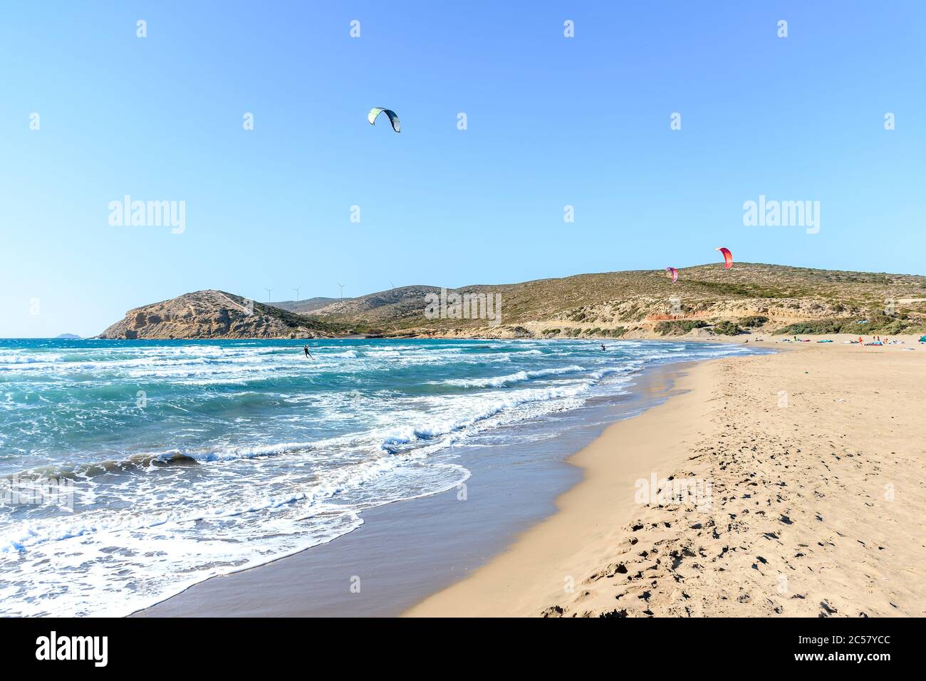 Prasonisi beach with kitesurfers surfing in waves (Rhodes, Greece) Stock Photo