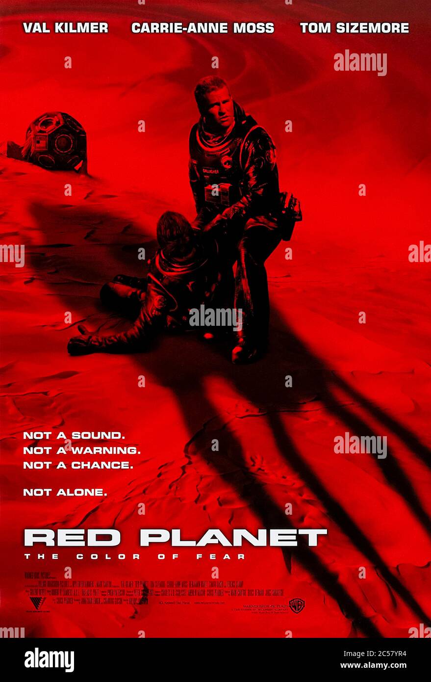 Red Planet (2000) directed by Antony Hoffman and starring Val Kilmer, Carrie-Anne Moss, Tom Sizemore and Terence Stamp. In 2056 astronauts search Mars for solutions to save a dying planet Earth but find unfriendly Martians. Stock Photo