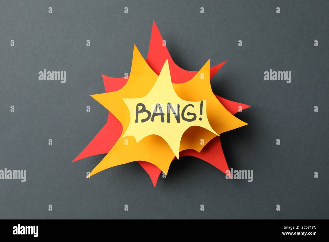 Decorative text Bang on black background. Explosion, shot Stock Photo