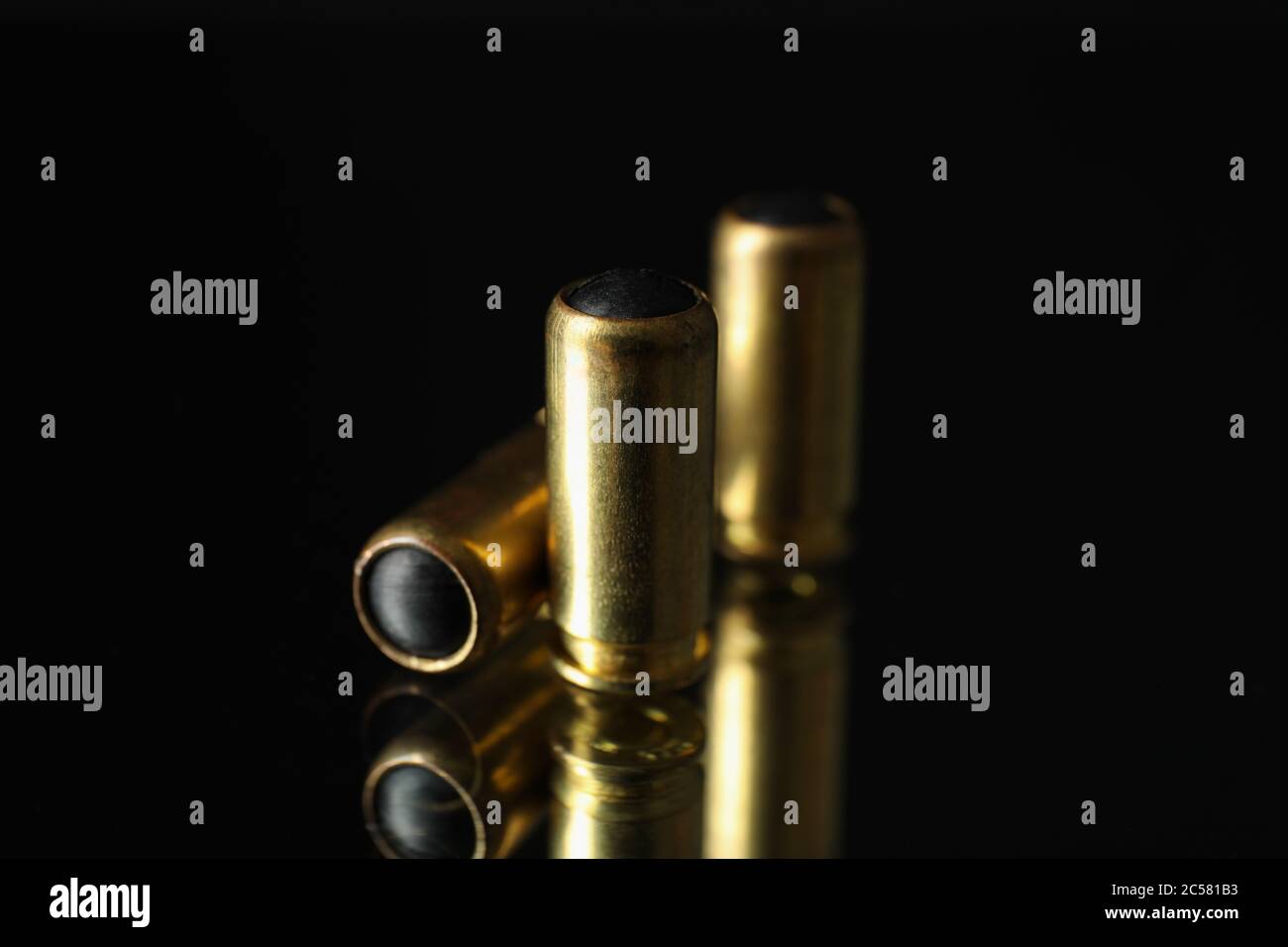 Rubber bullets on mirror background. Self defense weapon Stock Photo Alamy