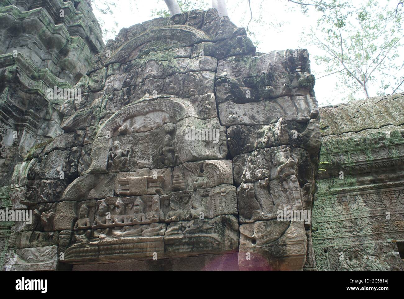 Very old and huge city Angkor Wat in Cambodia, state Siem Reap. Amazing stone buildings, a lot of green and fantastic architecture. Antic. Stock Photo