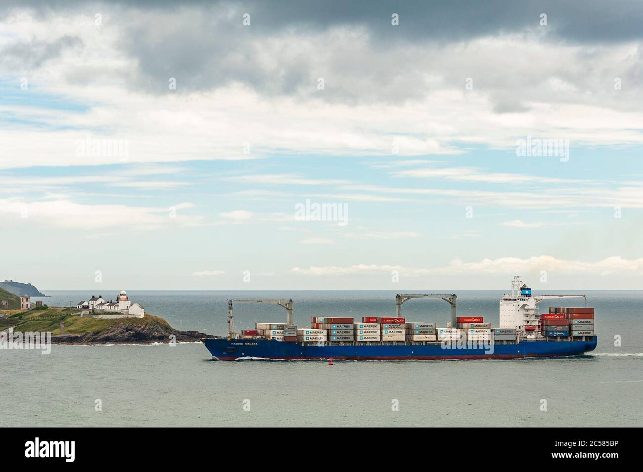 Weavers Point, West Cork, Ireland. 1st July, 2020. On an overcast but warm and humid day, container ship 'Maersk Niagra', sails past Roches Point at the entrance to the Port of Cork. The ship is carrying Ireland's weekly supply of bananas into Ringaskiddy Deep Water Berth. Credit: AG News/Alamy Live News Stock Photo