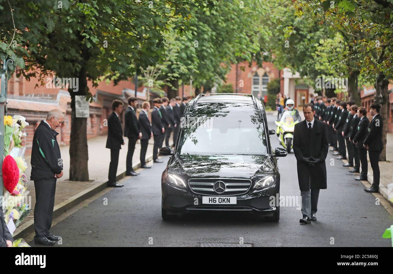 The funeral cortege of Noah Donohoe leaves Saint Malachy's College in Belfast, where the teenager went to school, where it paused for a short time flanked by his classmates following his private funeral service at Saint Patrick's Church. Stock Photo