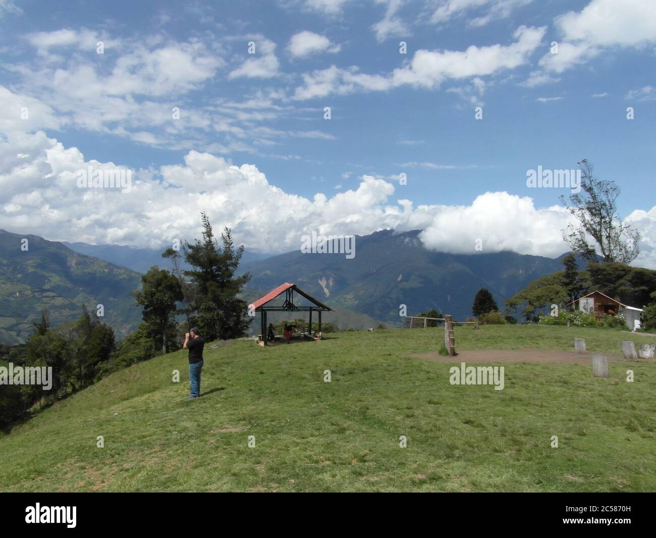 Stunning mountains in Banos and the famous "tree House". Casa de Arbol, Ecuador Stock Photo Alamy