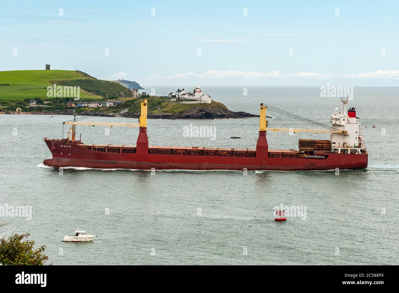 Weavers Point, West Cork, Ireland. 1st July, 2020. On an overcast but warm and humid day, general cargo ship 'Gala', sails past Roches Point at the entrance to the Port of Cork heading into the heart of Cork City to South Jetties. Credit: AG News/Alamy Live News Stock Photo