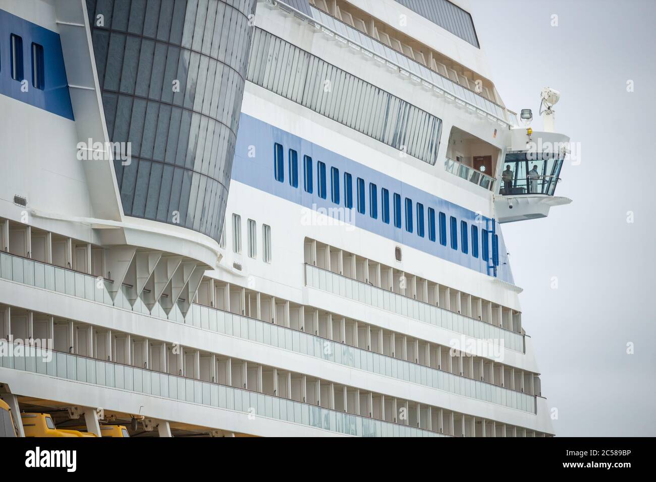 Las Palmas, Gran Canaria, Canary Islands, Spain. 1st July, 2020. Crew look out from the bridge of cruise ship Aida Stella in Las Palmas port. There are beleived to be more than 100,000 workers and crew on quarantined/idle cruise ships worldwide. With Spain and many other EU countries opening borders to tourists, there is still  uncertainty regarding the resumption of cruising holidays. Credit: Alan Dawson/Alamy Live News. Stock Photo