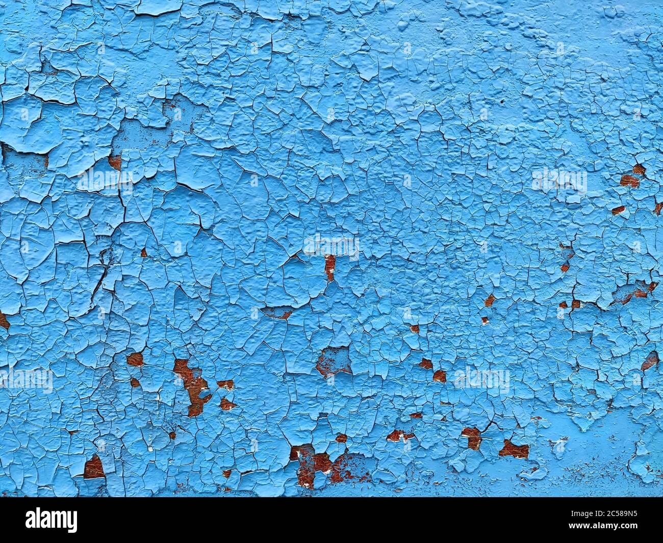 Rusty metal panel with cracked blue paint, corroded grunge metal background texture Stock Photo