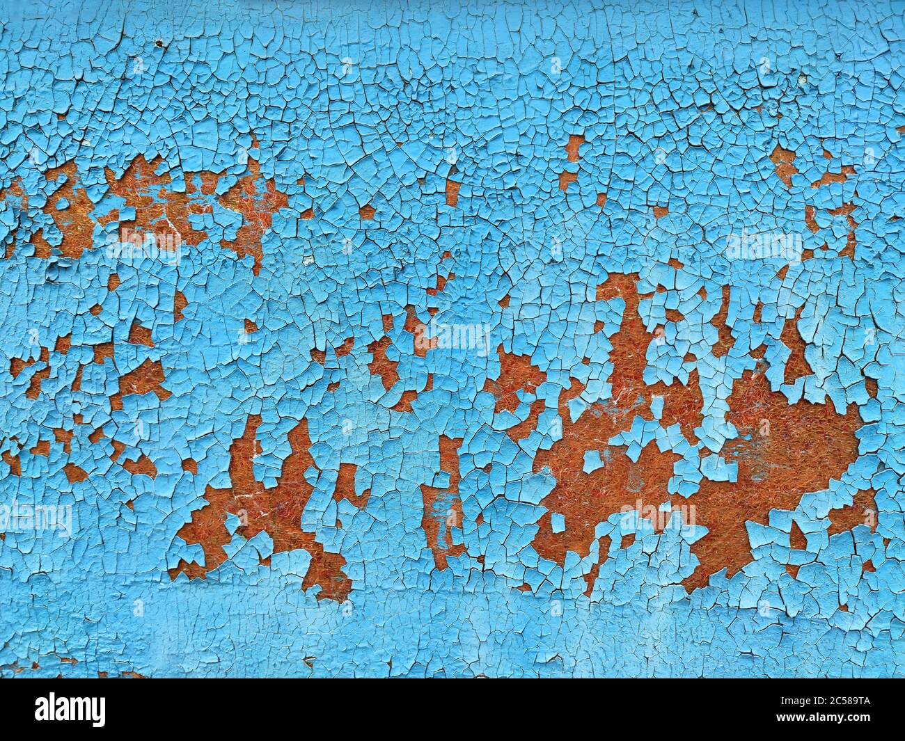 Rusty metal panel with cracked blue paint, corroded grunge metal background texture Stock Photo