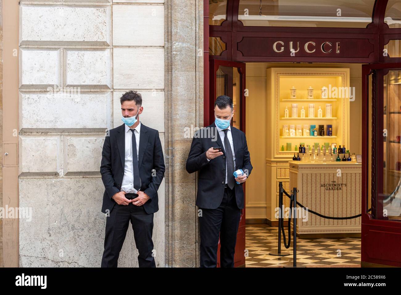 Doormen at the Gucci store in Via Condotti in Rome, Italy Stock Photo