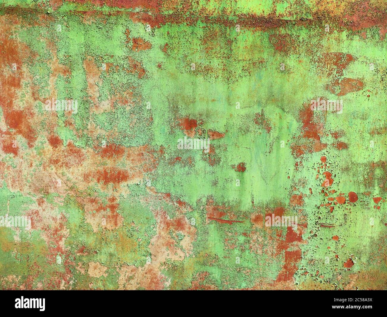 Corroded metal background. Rusted white painted metal wall. Rusty metal background with streaks of rust. Rust stains. The metal surface rusted spots. Stock Photo