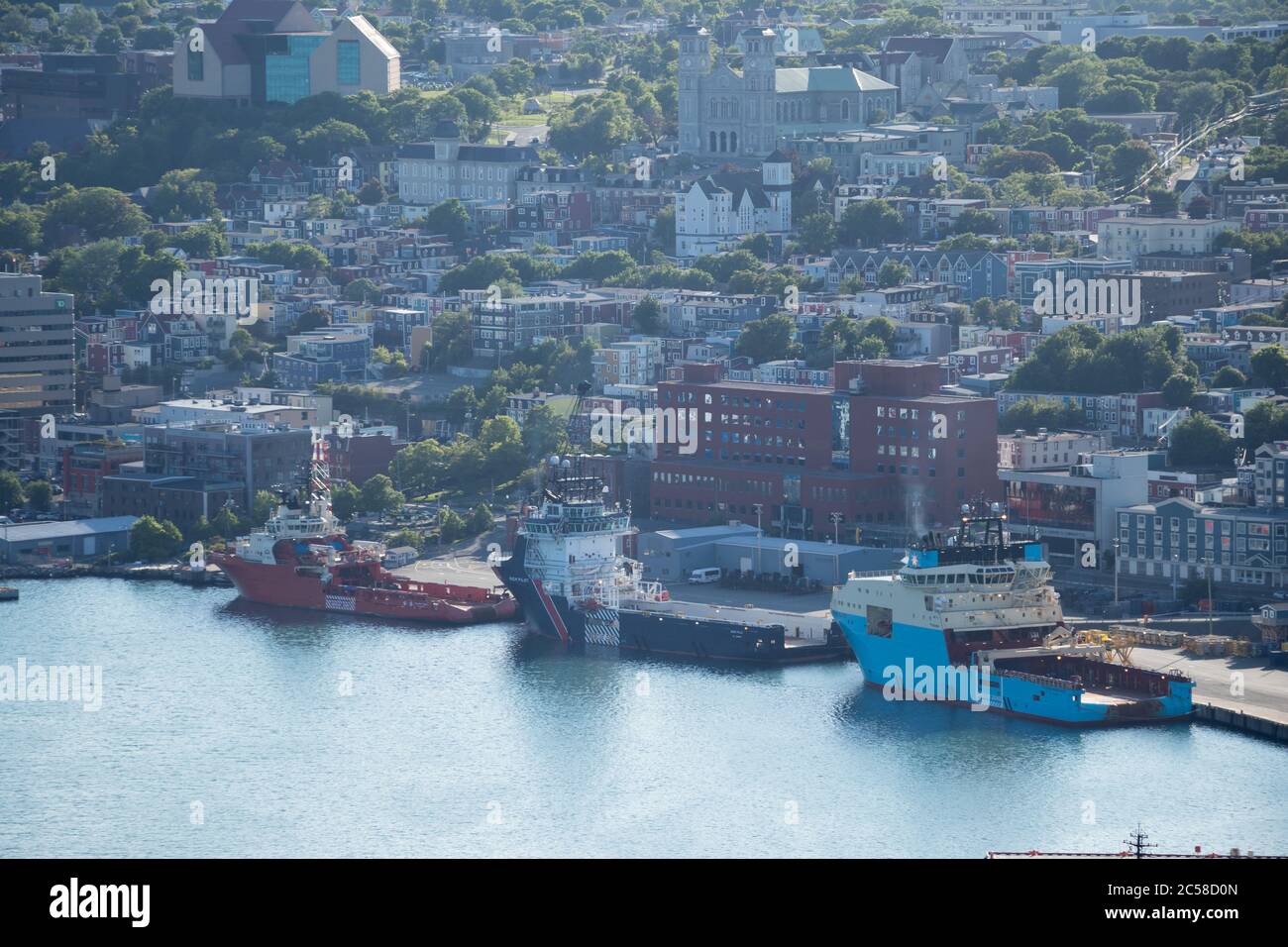Three ships lined up on the docks of St. John's Harbour, as seen from Signal Hill, Newfoundland. Stock Photo