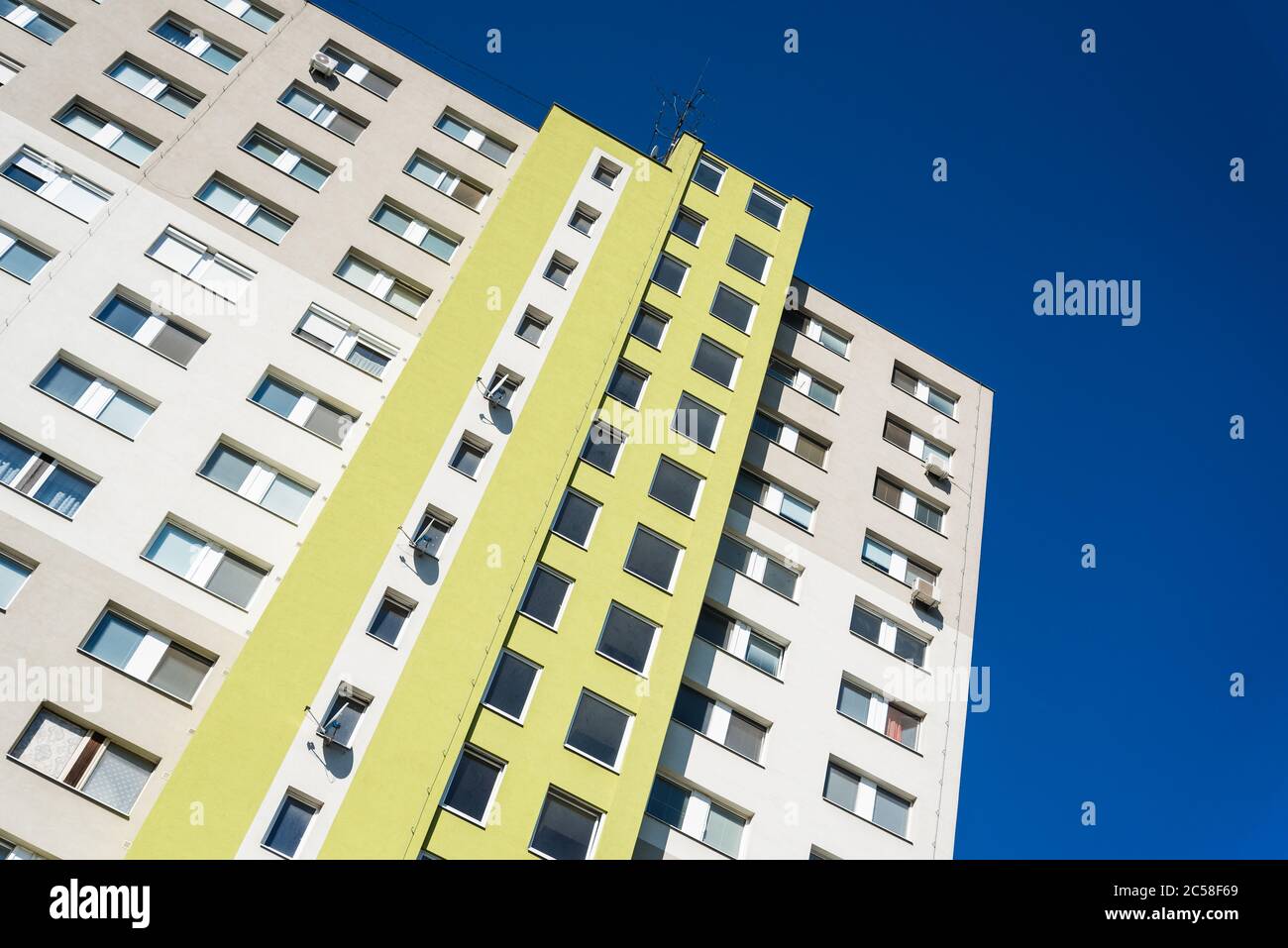 High modern apartment building under blue sky. Real estate background Stock Photo