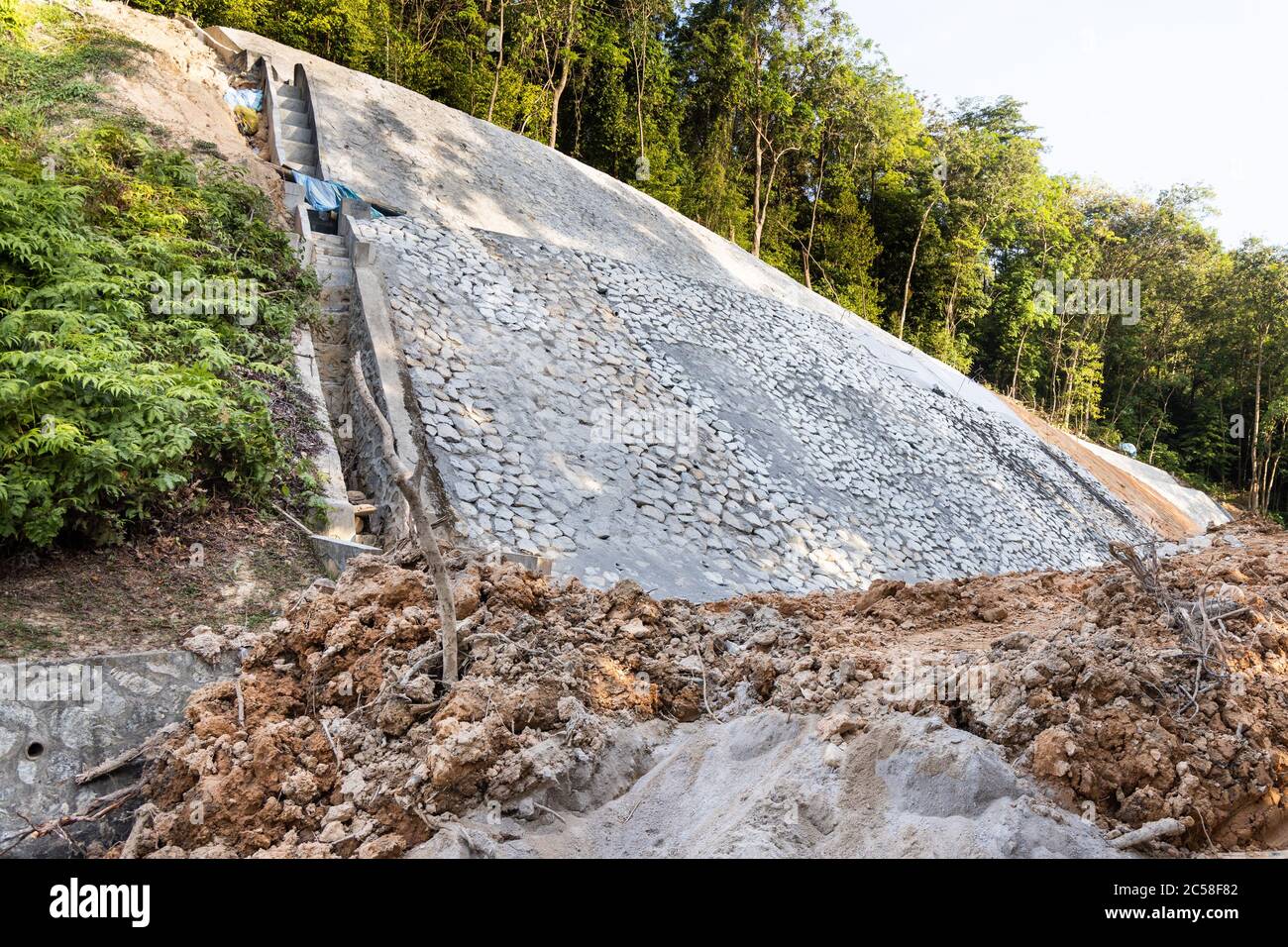 Slope retention construction work being carried out to manage landslide