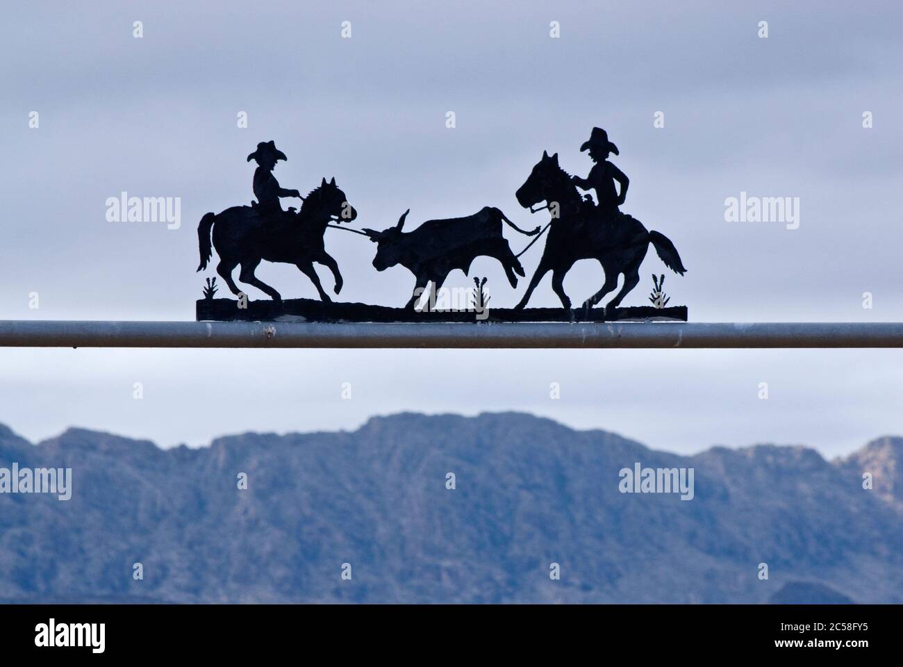 Wrought iron ranch sign at gate in Chihuahuan Desert near Presidio ...
