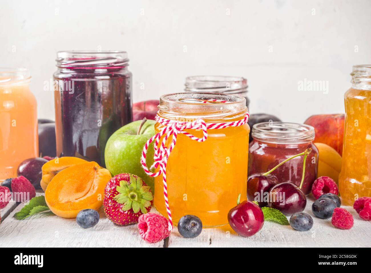 Assortment of berries and fruits jams. Set of various seasonal summer