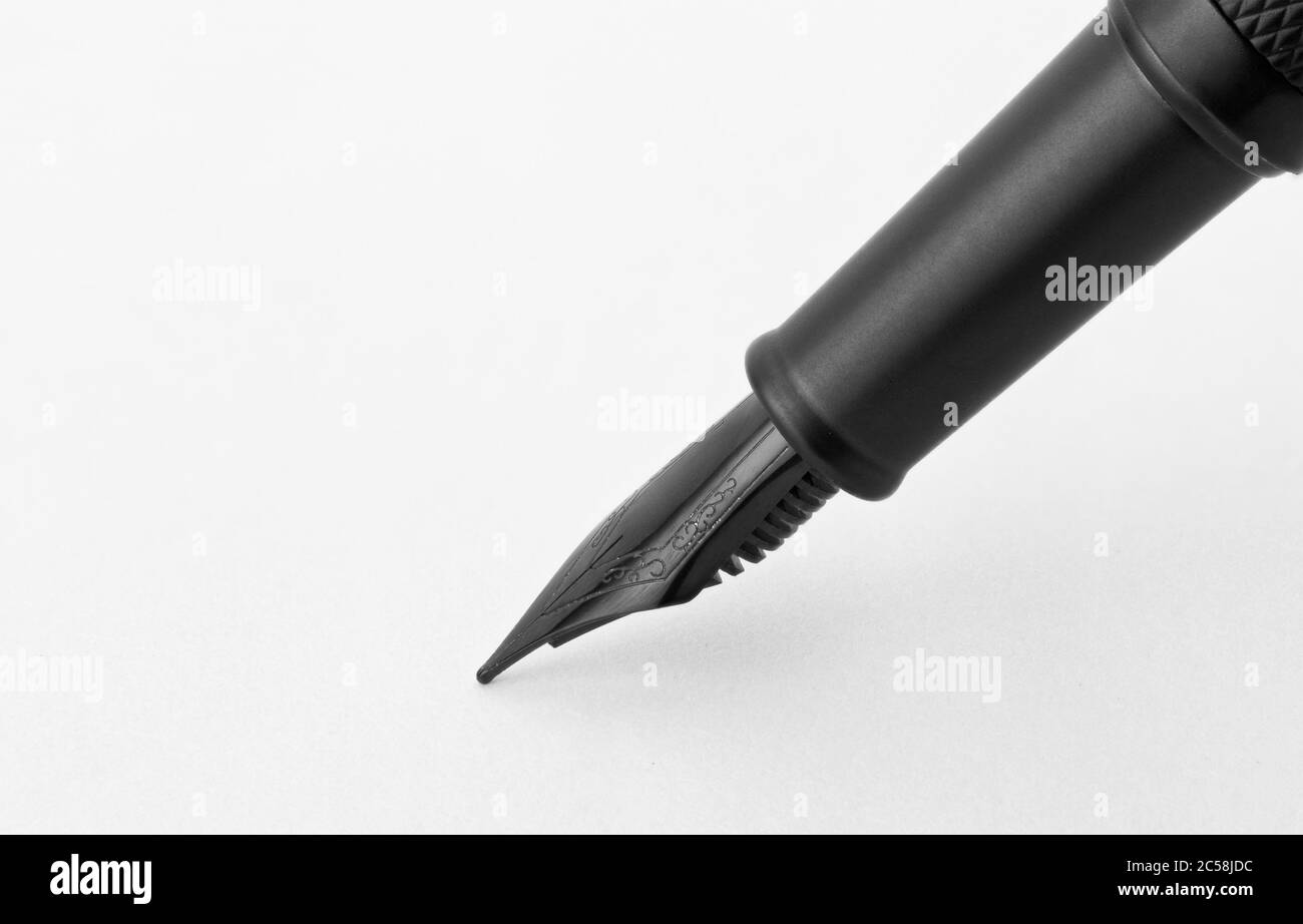 Black fountain writing pen isolated on white background Stock Photo - Alamy
