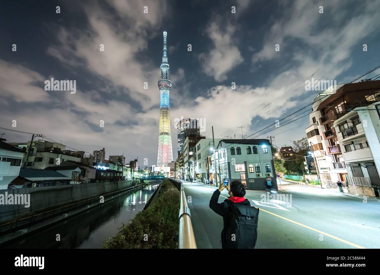 TOKYO, JAPAN - Mar 28, 2019: Tokyo Skytree, Sumida Ward Urban night scene. Tokyo Skytree tower reflections on the canal. Stock Photo
