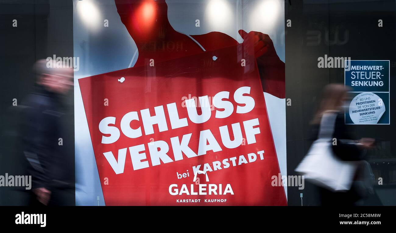 Hamburg, Germany. 01st July, 2020. Signs with the inscription 'Sale at Karstadt Galeria' and 'Reduction of VAT' can be seen in the shop window of a Karstadt/Galeria branch on Mönckebergstraße in Hamburg city centre. In order to revive corona-weakened consumption, the German government is reducing the VAT from 19 to 16 percent and the reduced VAT rate from 7 to 5 percent for six months from 1 July 2020. Credit: Christian Charisius/dpa/Alamy Live News Stock Photo