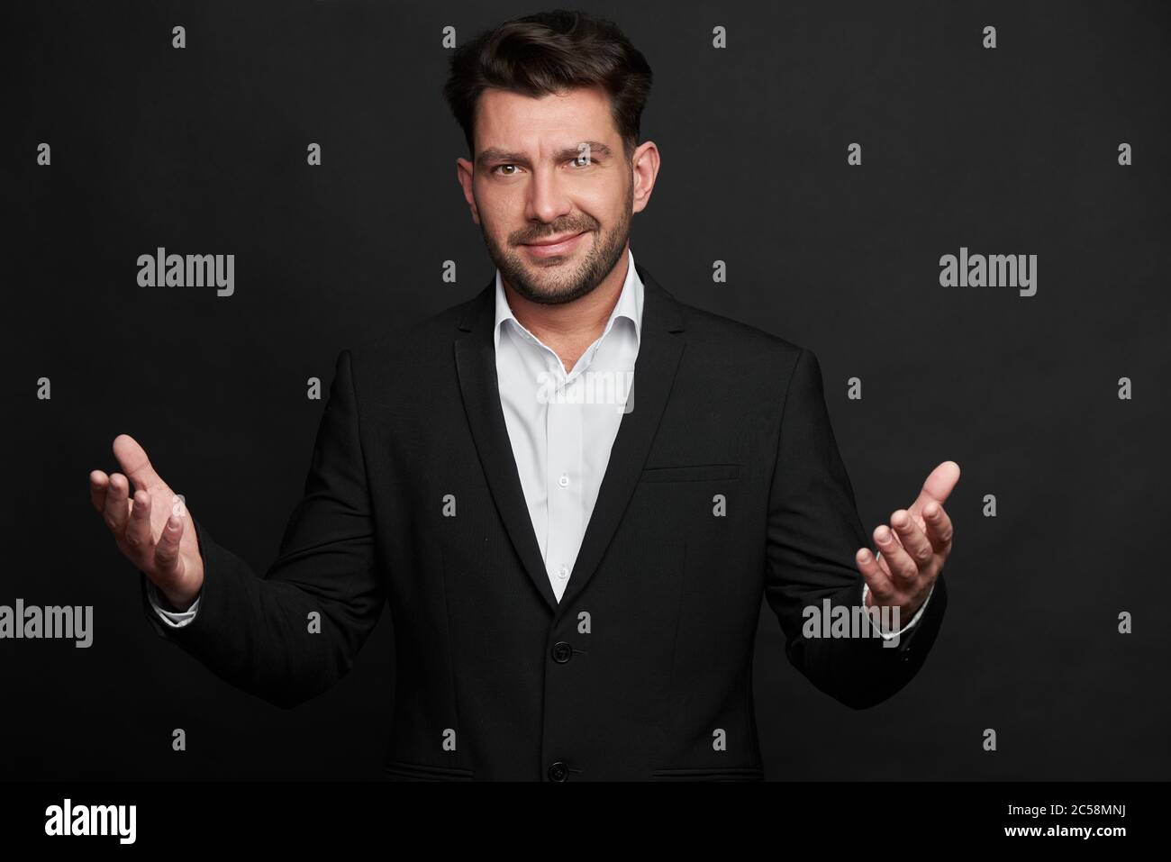 Portrait of handsome man in black suit Stock Photo - Alamy