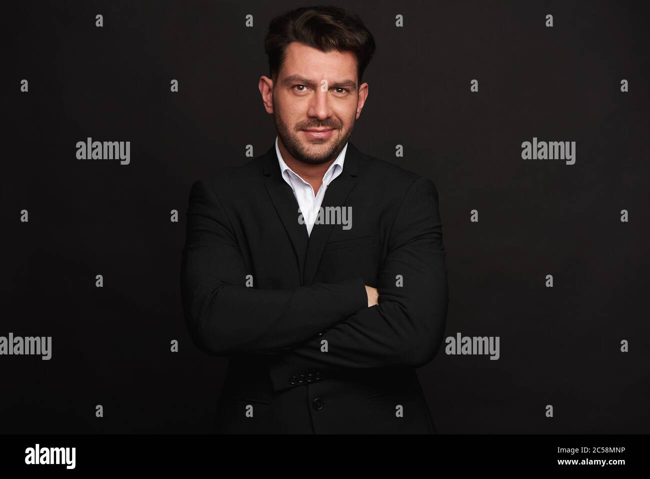 Man in black suit hi-res stock photography and images - Alamy