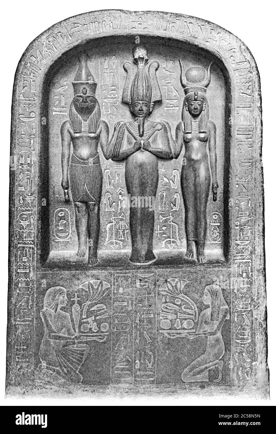 Osiris, flanked by Horus Isis, ancient Egyptian religion Stock Photo