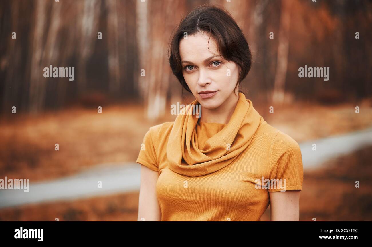 Woman in yellow sweater wearing hi-res stock photography and images - Alamy
