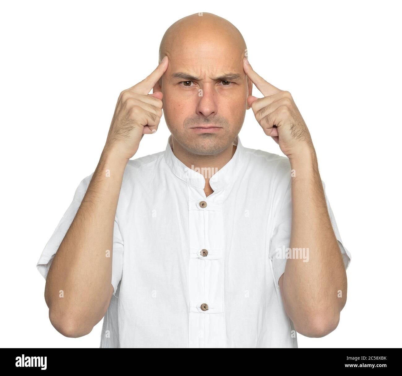 Angry bald man in casual white shirt is thinking. Isolated Stock Photo