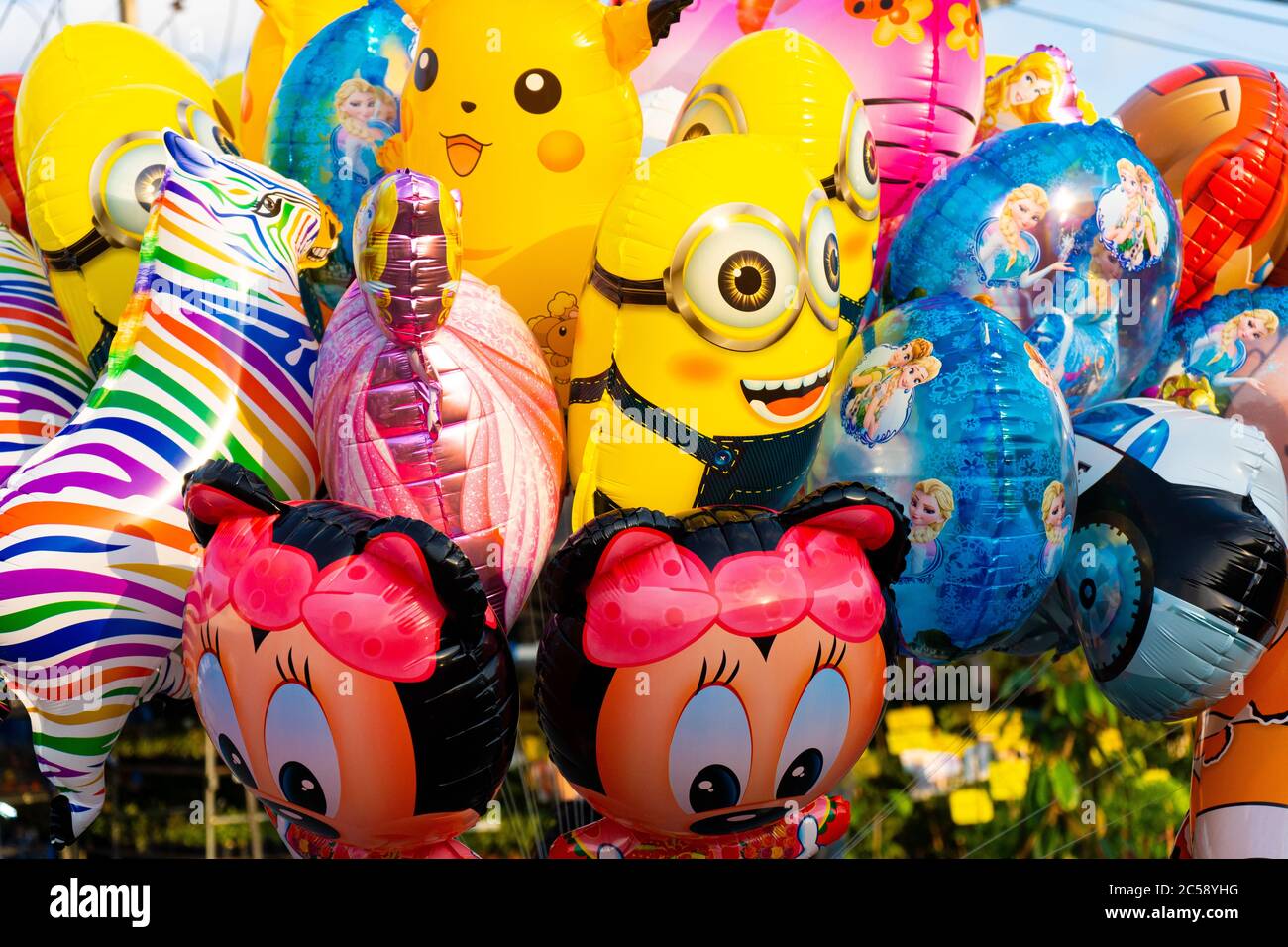 Funny colored balloons in the form of cartoon characters. Joy for the baby  Stock Photo - Alamy