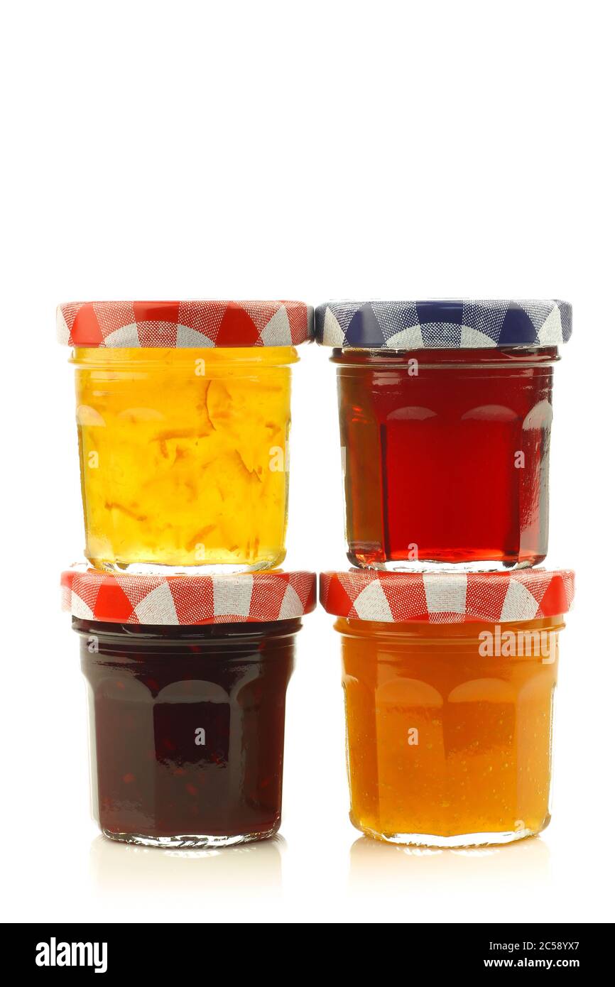 glass jars with assorted  jam and marmalade with room for your label, text or images on a white background Stock Photo