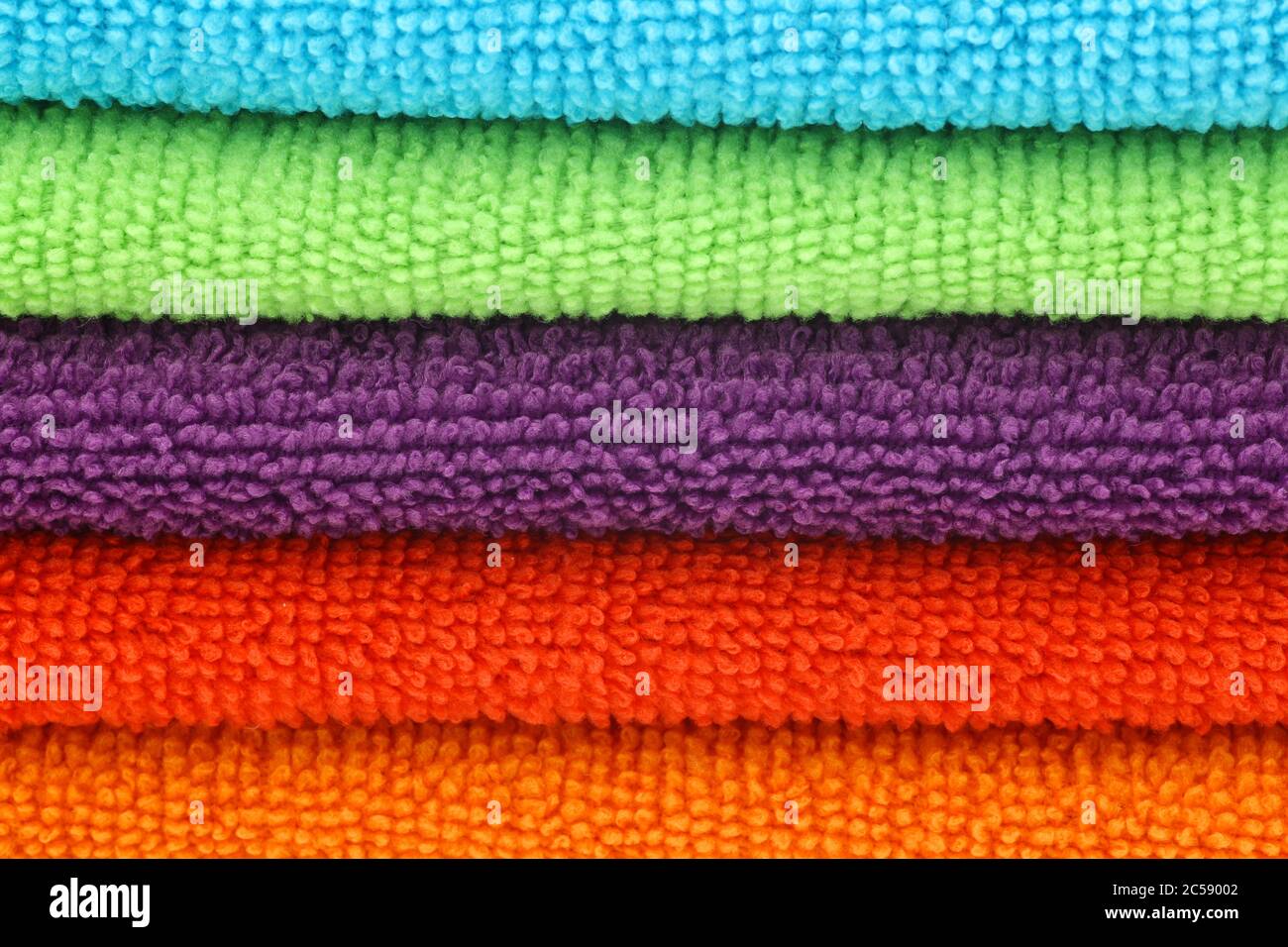 stacked colorful microfiber cleaning cloths background Stock Photo