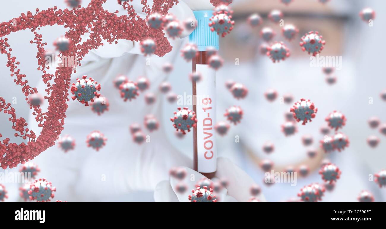 Covid-19 cells and DNA structure against scientist holding a test tube Stock Photo