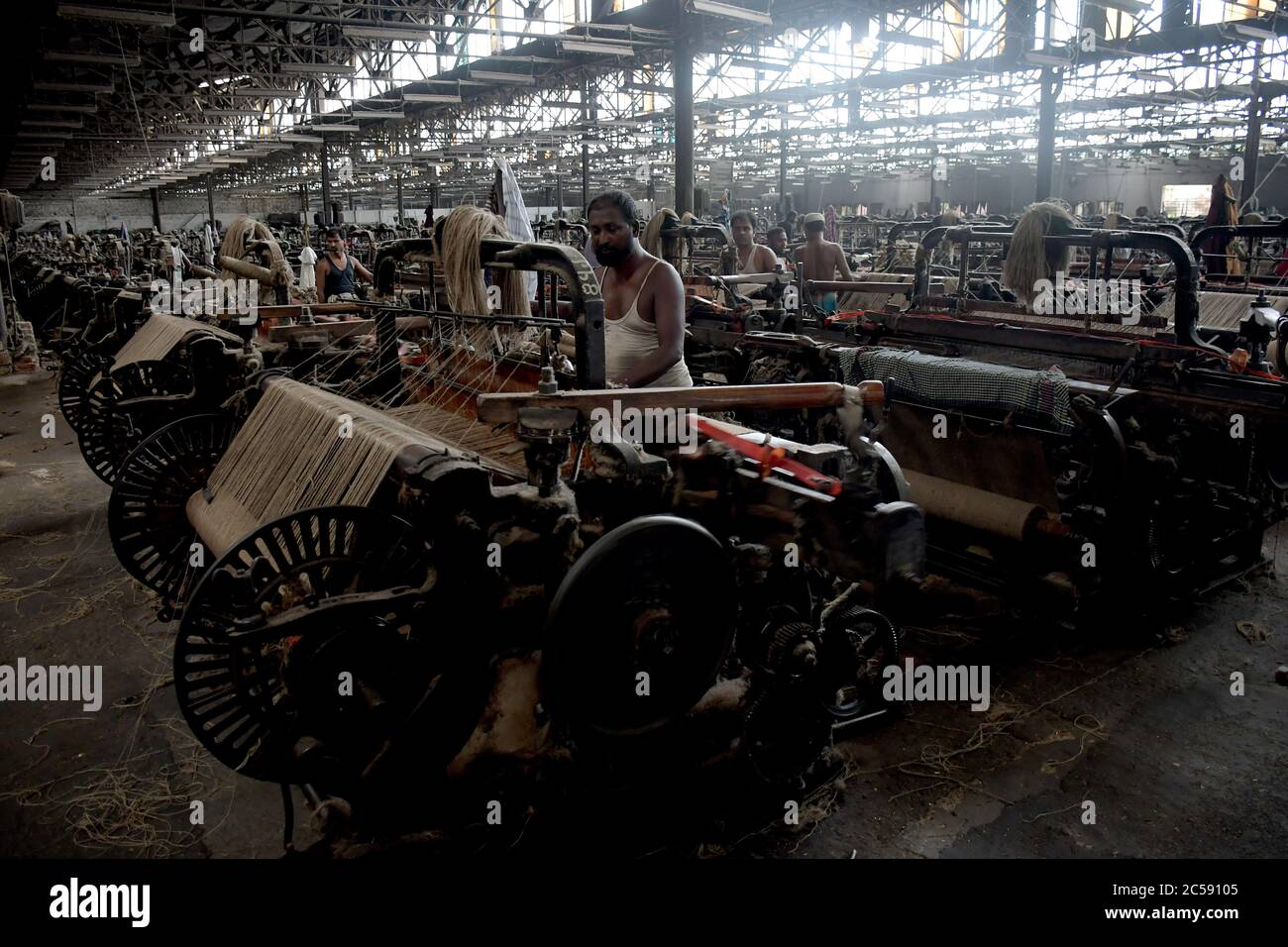 DHAKA, BANGLADESH - 01JULY 2020:  Workers busy in making jute sacks at jute processing mill in Narayanganj near Dhaka,. Jute Industry in Bangladesh is an industry that is historically and culturally important that once was the biggest industry in the region. Stock Photo