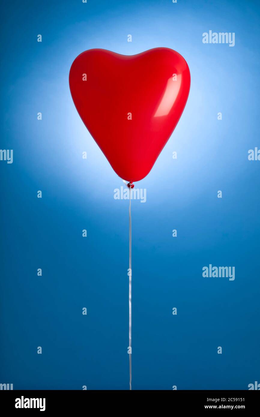 Blue balloon with string hi-res stock photography and images - Alamy