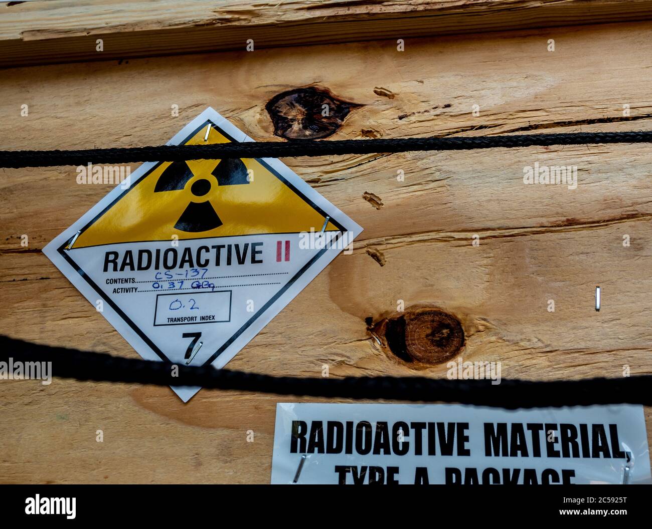 The radioactive material label beside the transportation wooden box