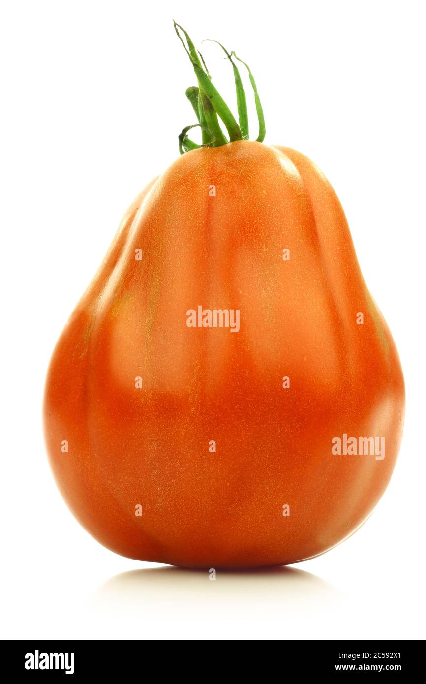 fresh beef tomato on a white background Stock Photo - Alamy