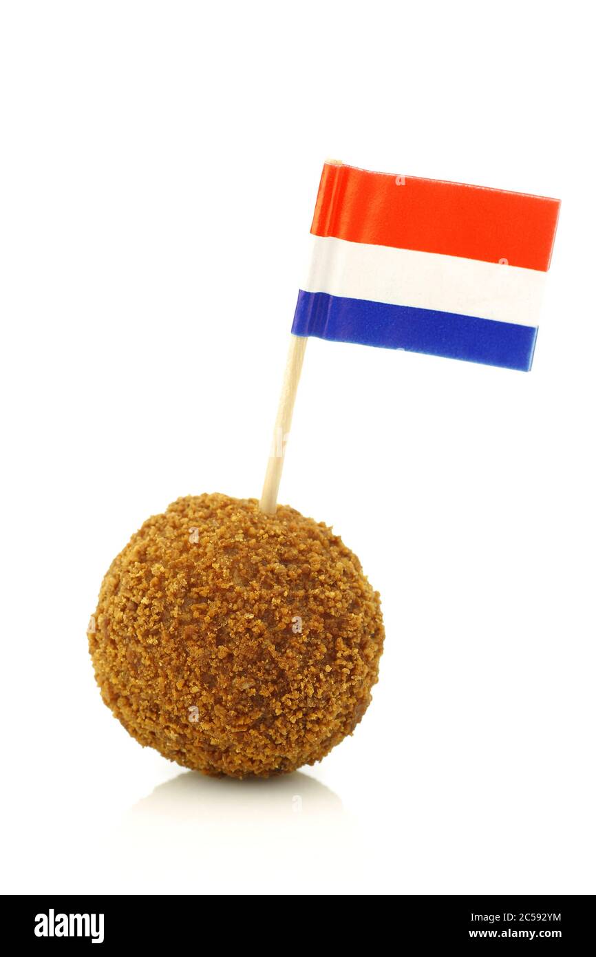 A real traditional Dutch snack called 'bitterbal' with a Dutch flag toothpick on a white background Stock Photo