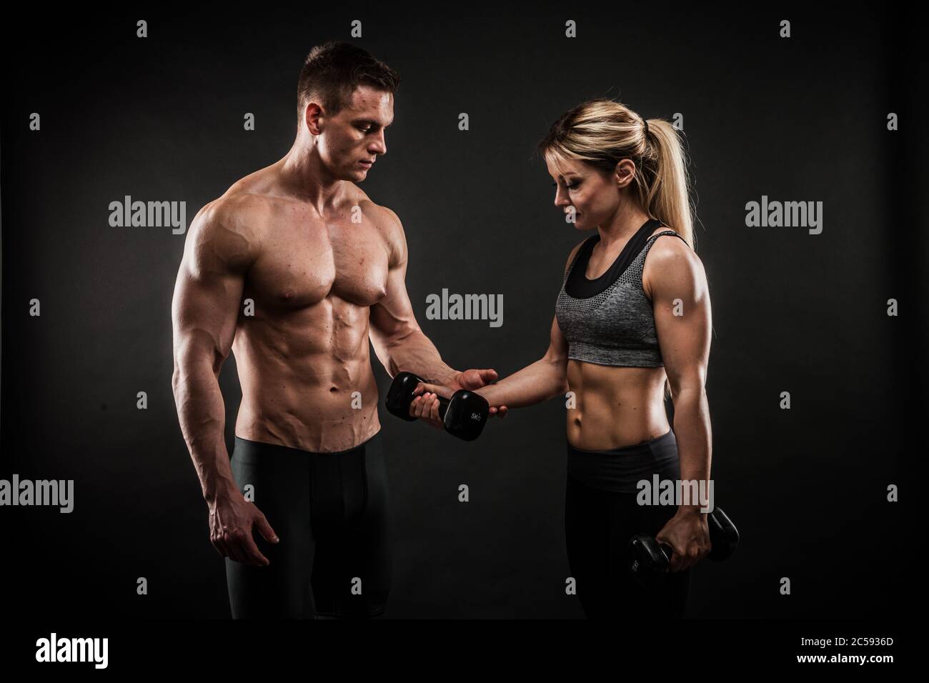 Fitness in gym, sport and healthy lifestyle concept. Couple of athletic