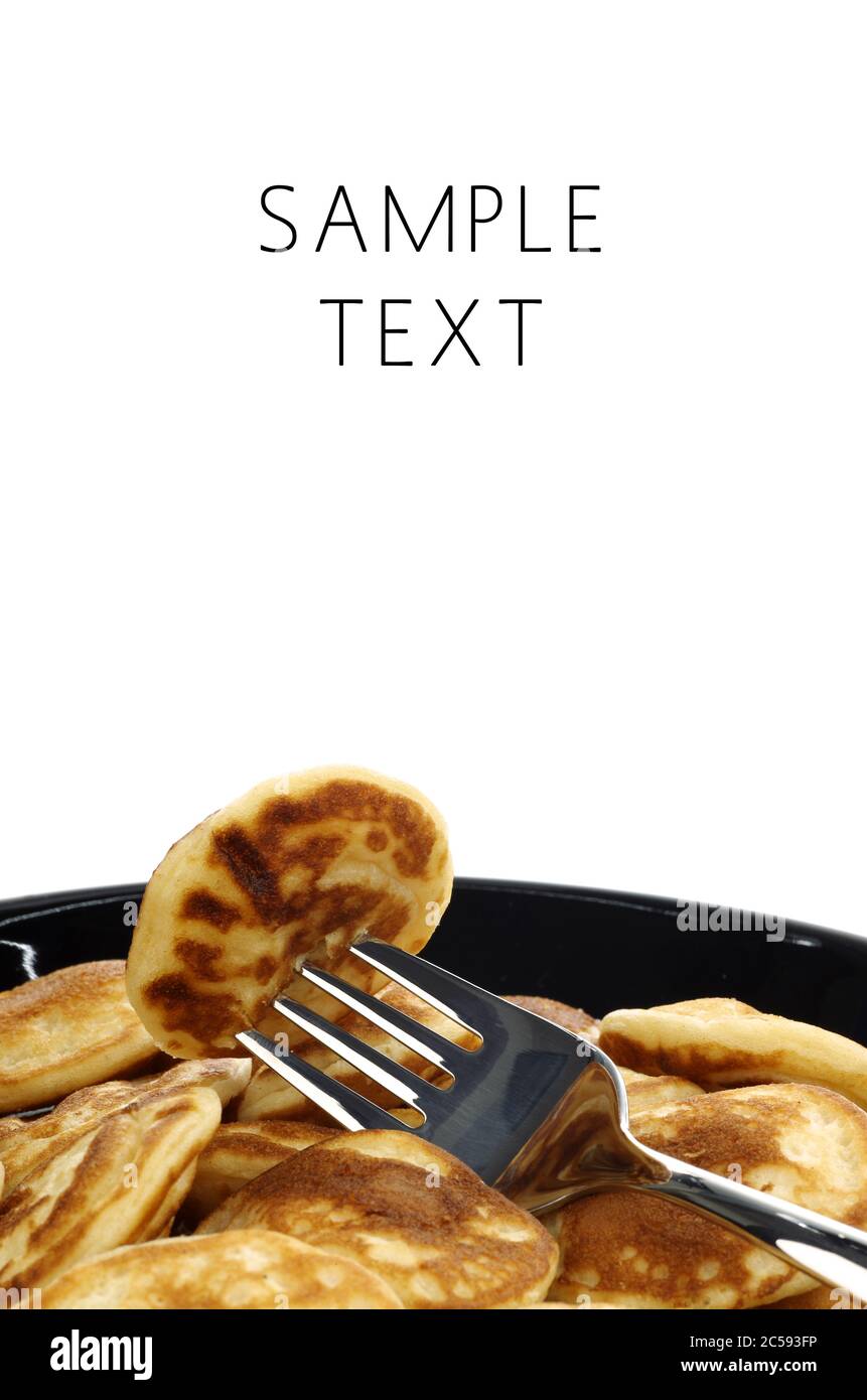 freshly baked traditional Dutch mini pancakes called "poffertjes" on a