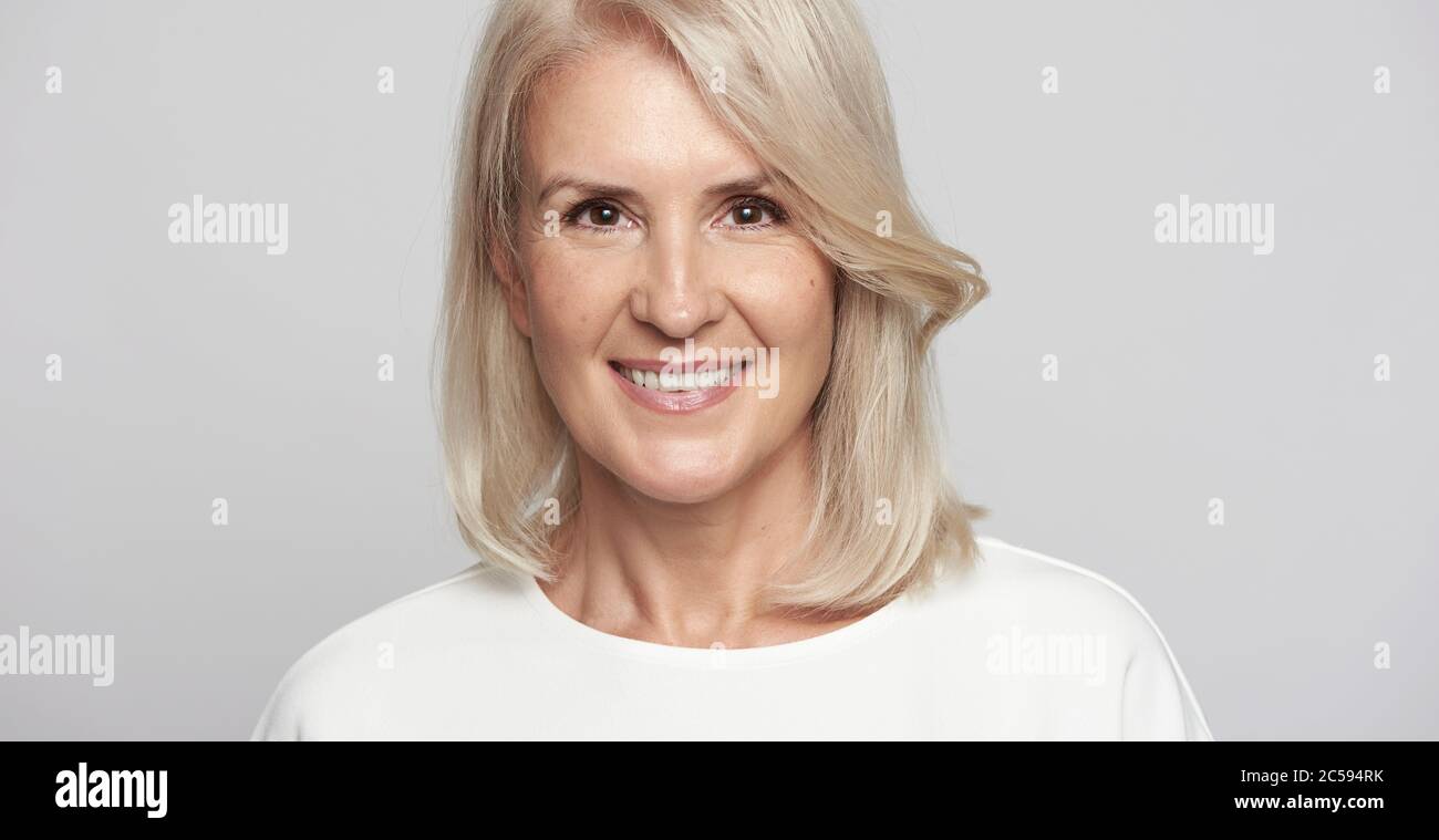 Beautiful 50 years old lady is smiling. Isolated Stock Photo Alamy