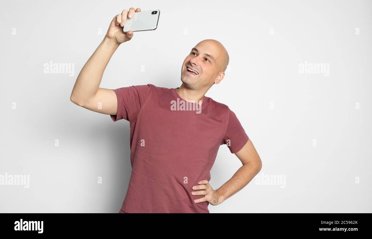 Bald man making funny face hi-res stock photography and images - Alamy