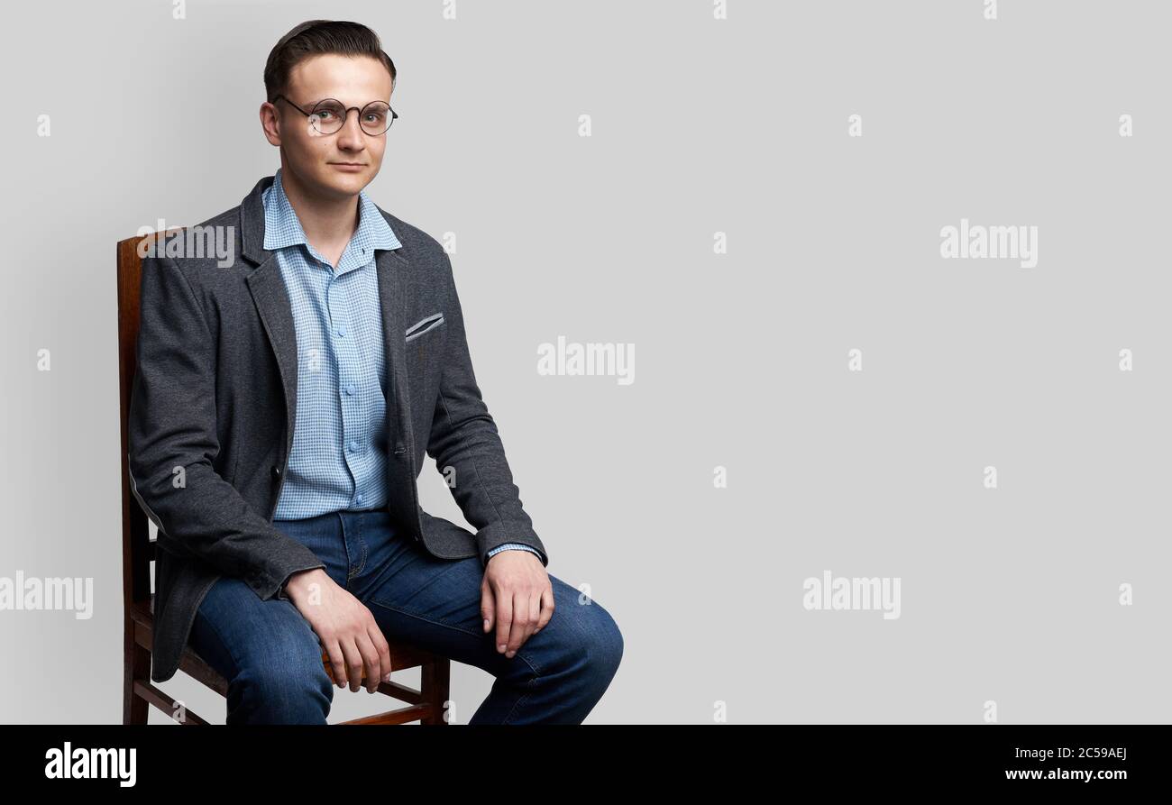 Man sitting chair studio shot hi-res stock photography and images - Alamy