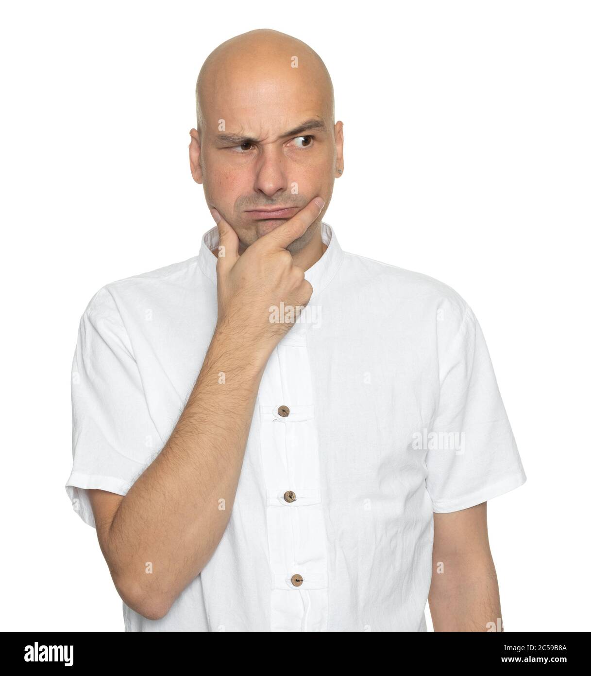 angry bald man looking away isolated on white background Stock Photo
