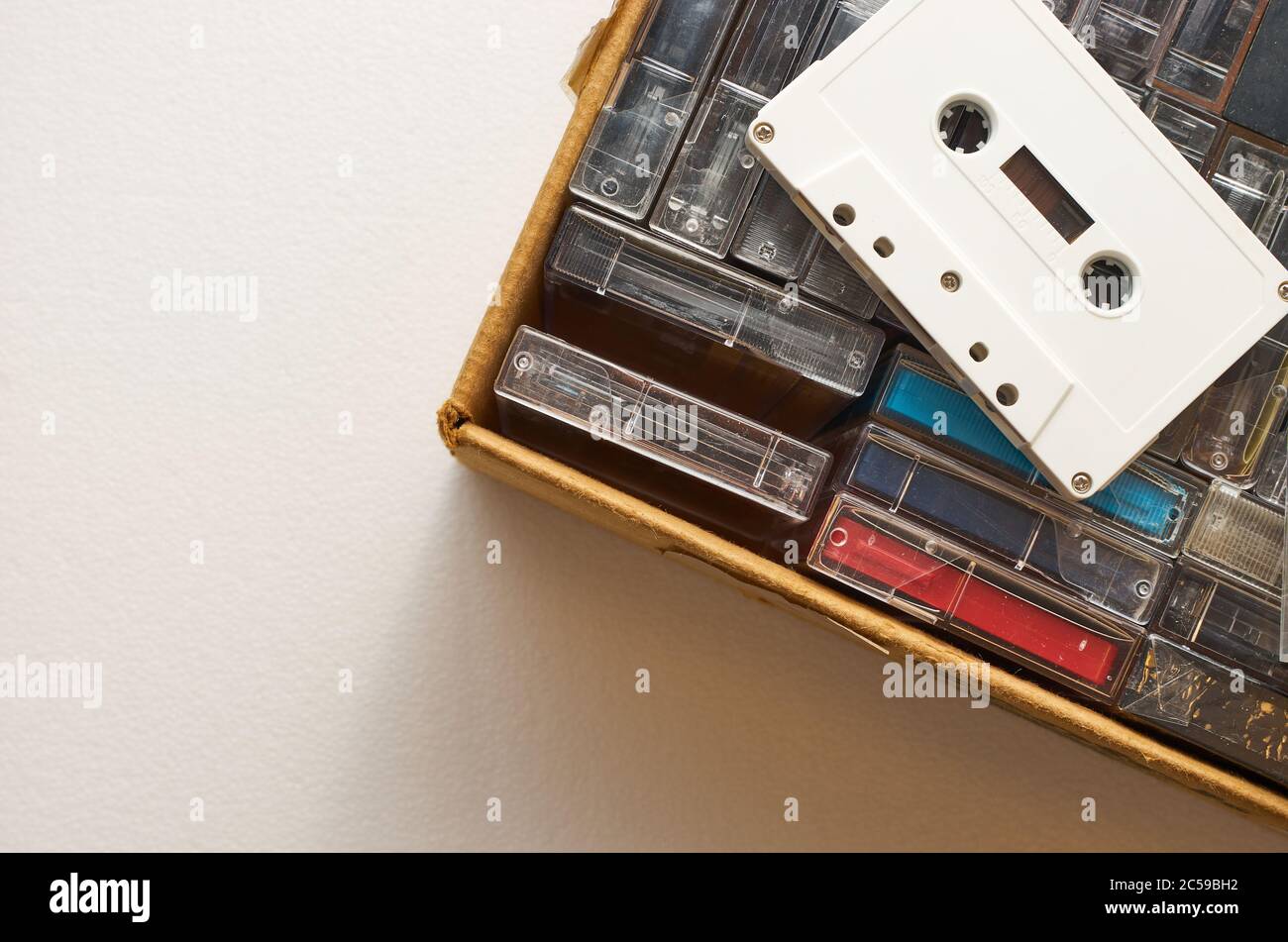 Single white audio cassette without markings on top of the box with