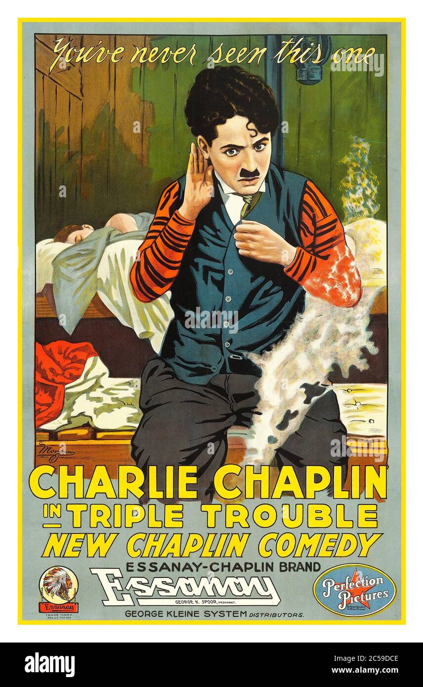 CHARLIE CHAPLIN Vintage silent 1918 movie film poster ‘Triple Trouble’ a Chaplin comedy, produced by ESSANAY-CHAPLIN brand. Triple Trouble is a two-reel American silent comedy film that was released in 1918. It stars Charlie Chaplin, Edna Purviance, and Leo White. This film was not an official Chaplin film, even though it has many Chaplin-directed scenes; after he left the studio, Essanay edited it together using outtakes and newly shot footage directed by Leo White. It had already been established in court that Chaplin had no legal control over the films made during his time with Essanay Stock Photo