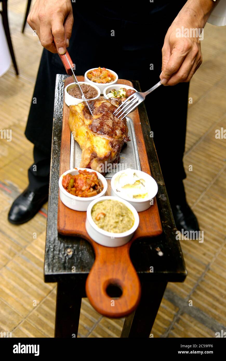 Argentina, Buenos Aires, restaurant la cabrera meat service Stock Photo