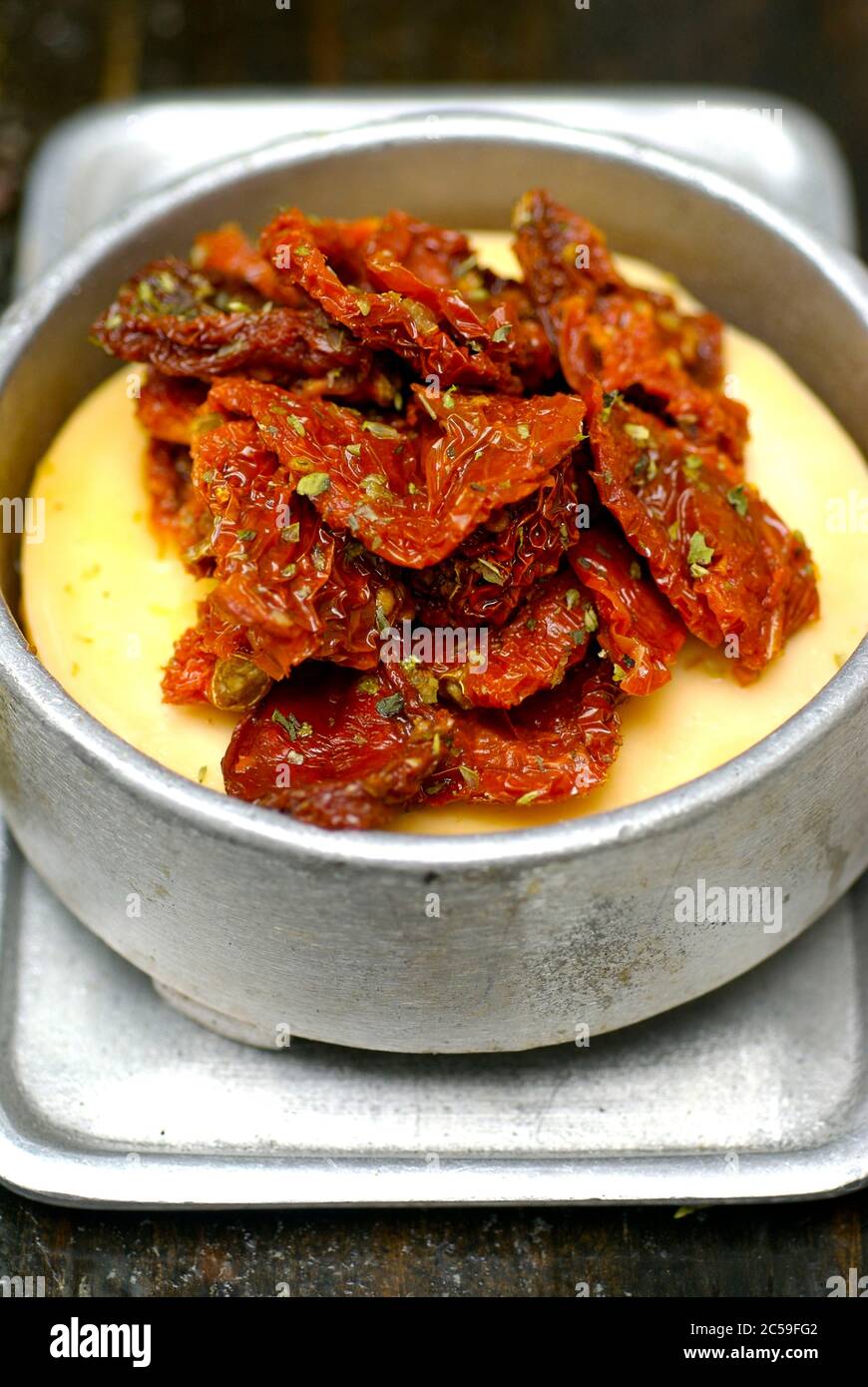 Argentina, Buenos Aires, restaurant la cabrera provolone roasted with candied tomato Stock Photo